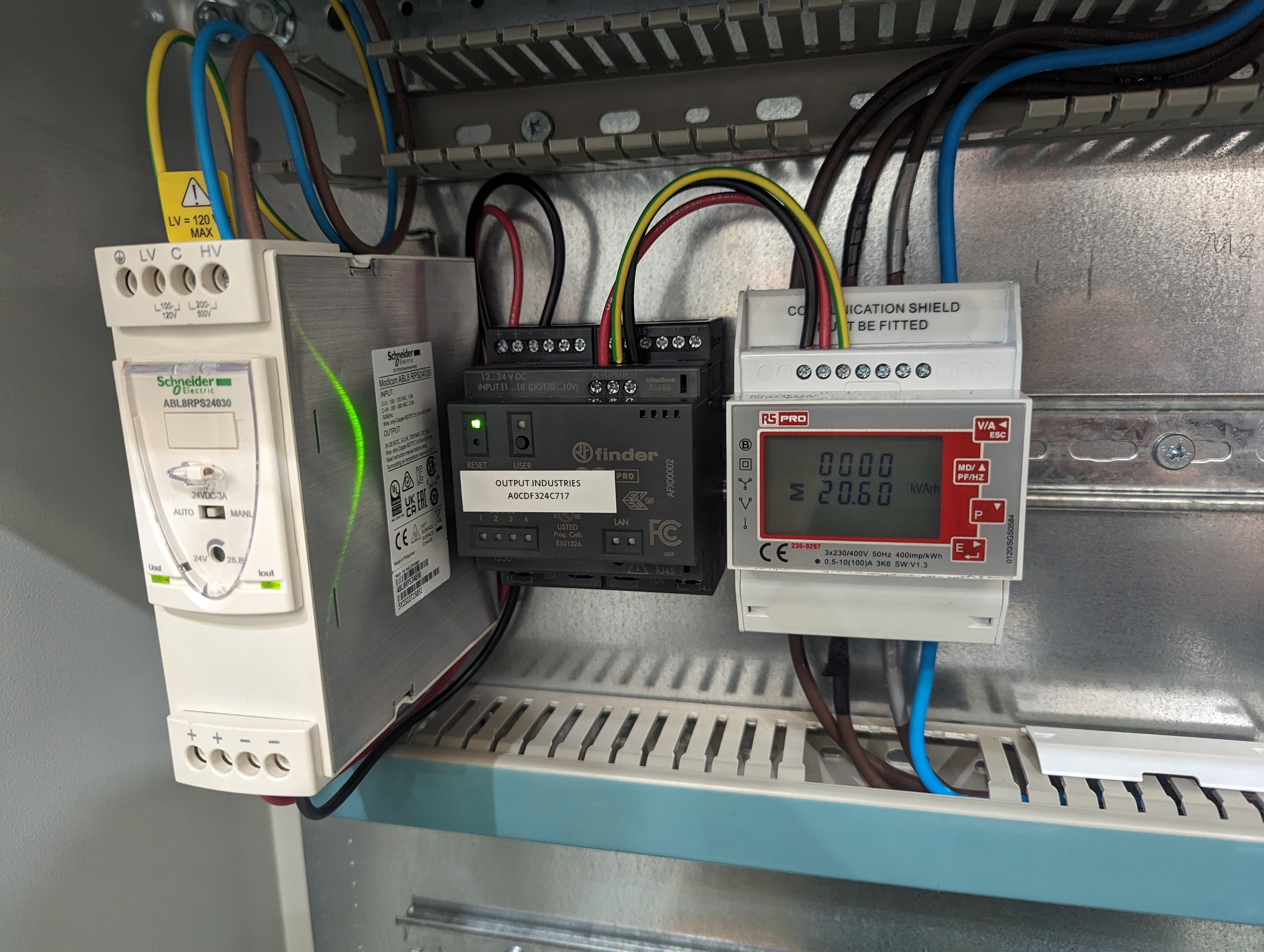 A three-phase meter installed in a cabinet next to an Arduino Opta